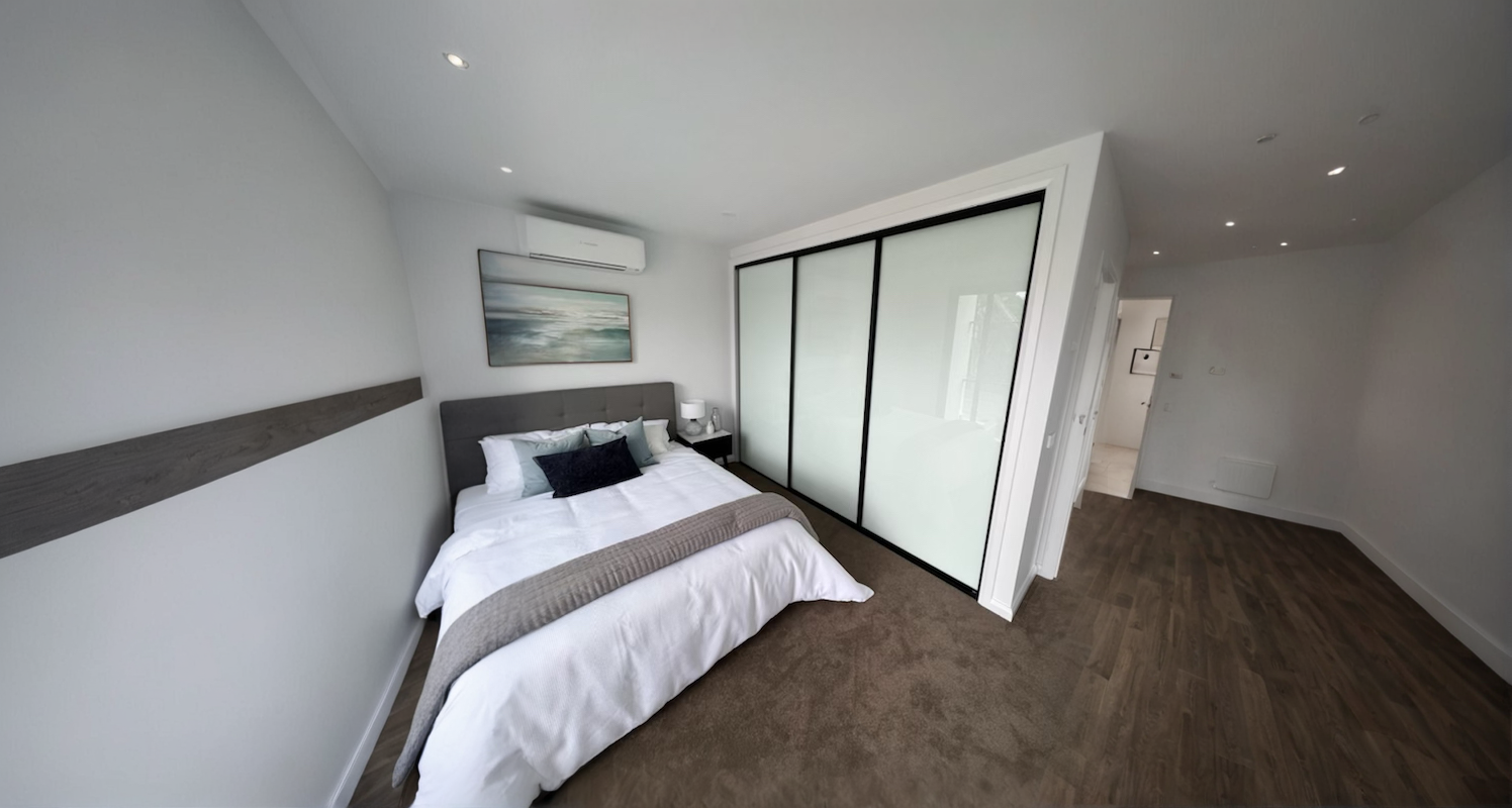 Modern bedroom with sliding wardrobe doors