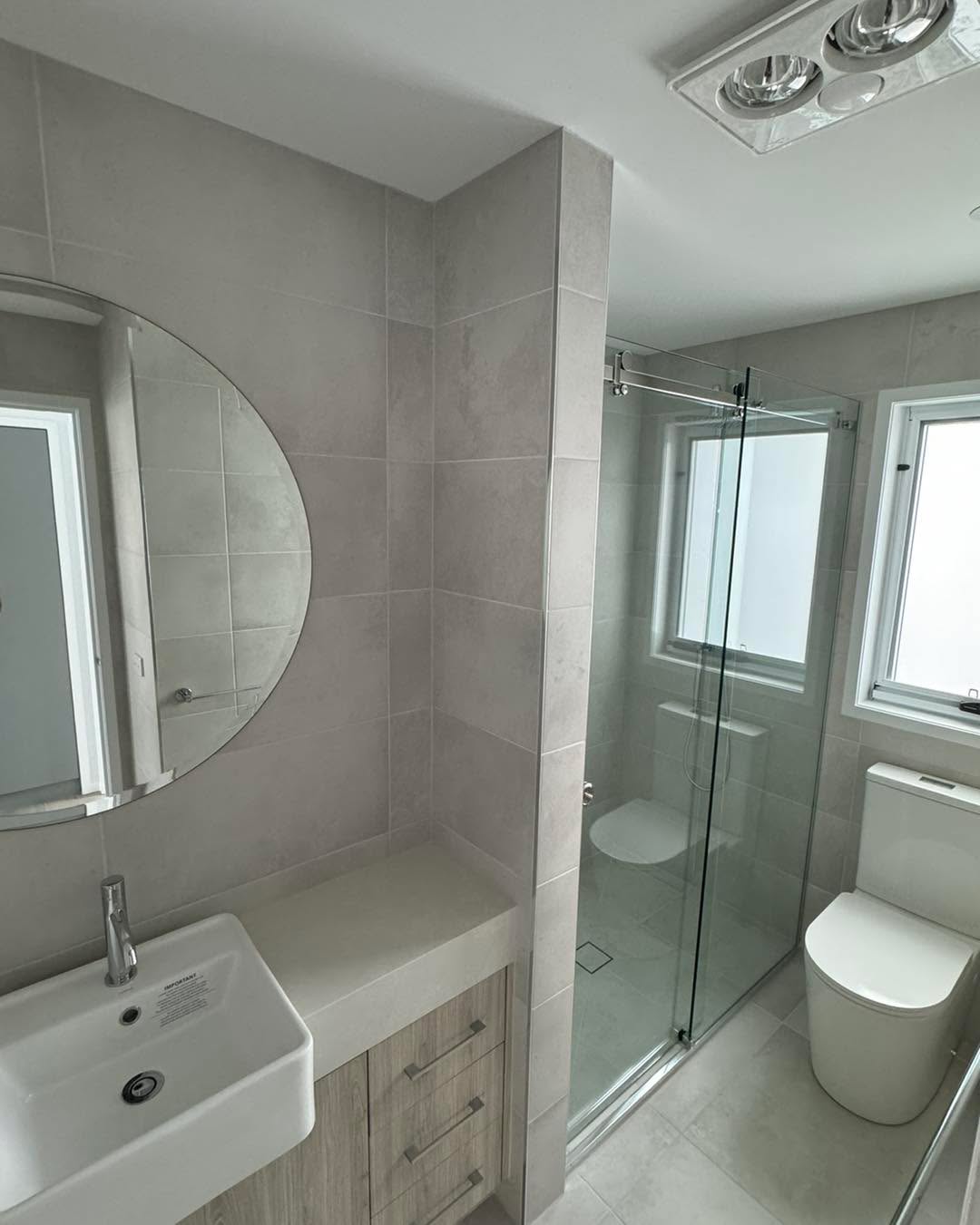 Bathroom with white sliding wardrobe doors